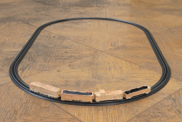 Justin Chance Understanding, 2021 SFX make-up, latex, scar wax, artificial, blood, tissue, mulberry paper, model train, railroad tracks Train: 24 x 1 3/4 x 2 inches, Track: 45 feet 9 inches, tracks are entirely variable 